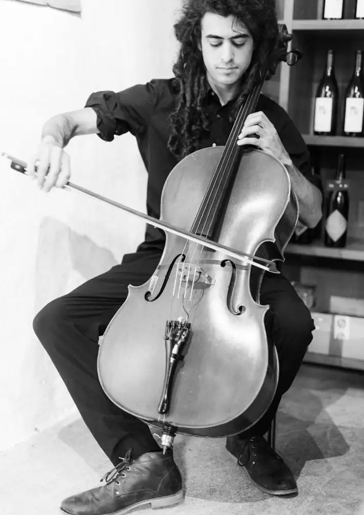 Gabriel performing cello on stage
